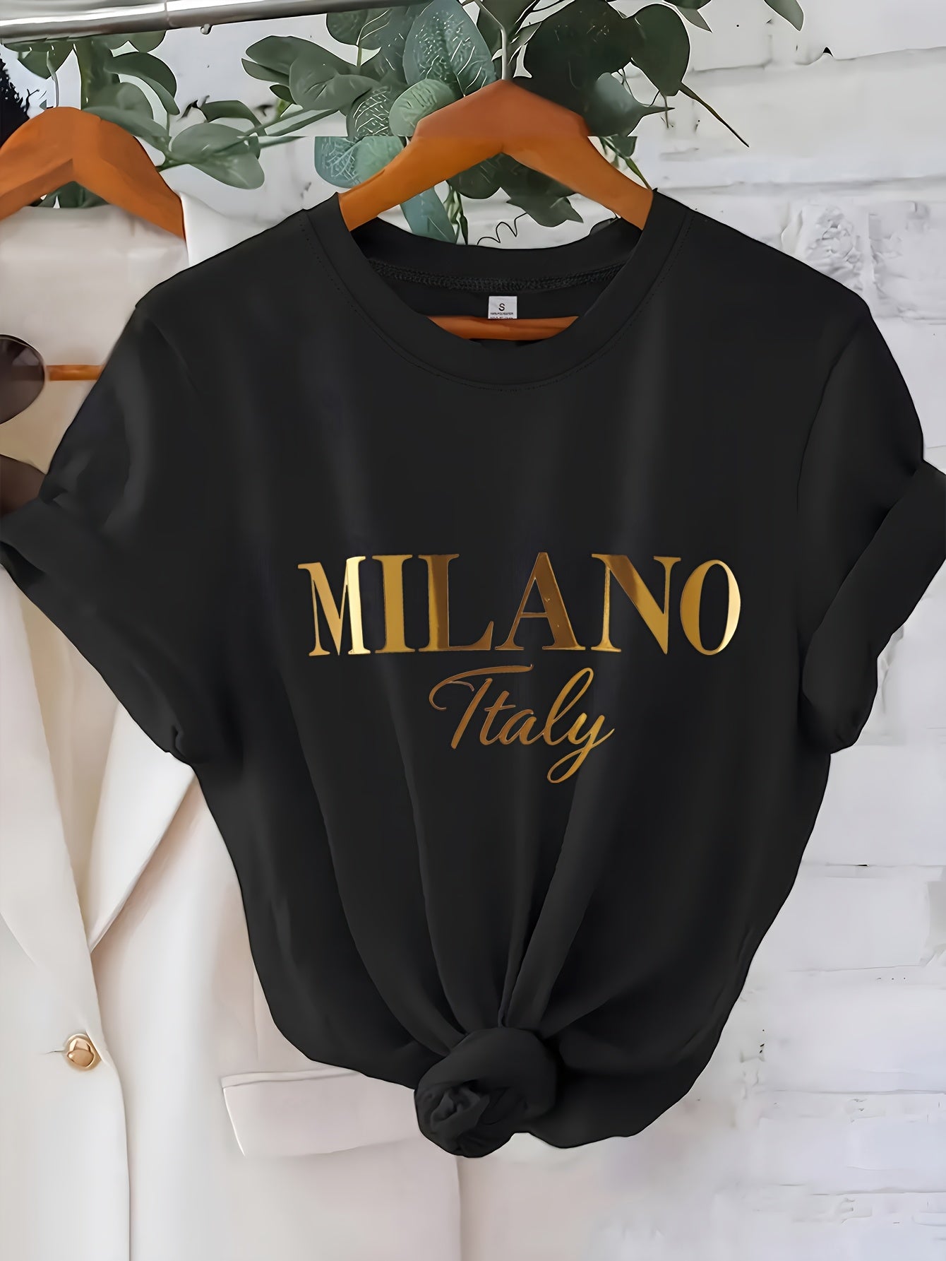 C571 Exuding elegance and modern luxury the design features MILANO in bold shimmering Golden uppercase letters with ITALY elegantly scripted in a smaller lighter font directly beneath all set against a deep black background T